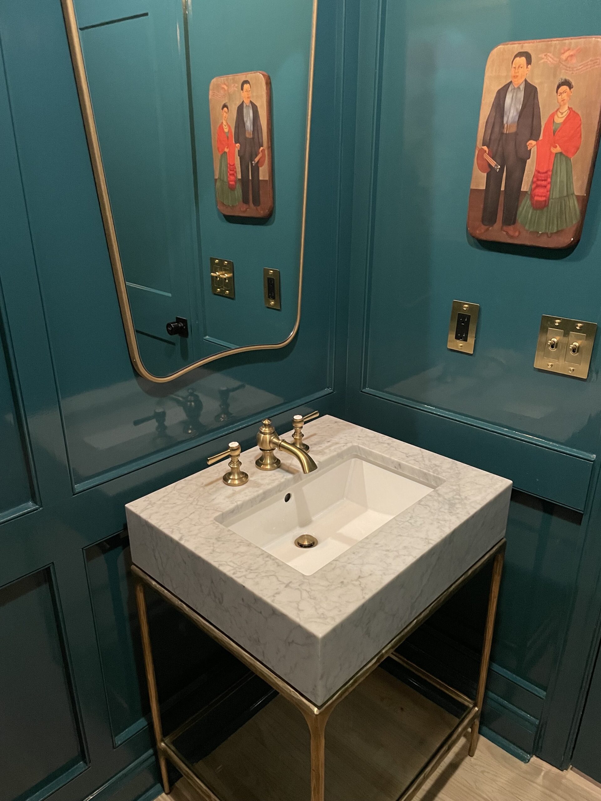 Bathroom sink with brass fixtures