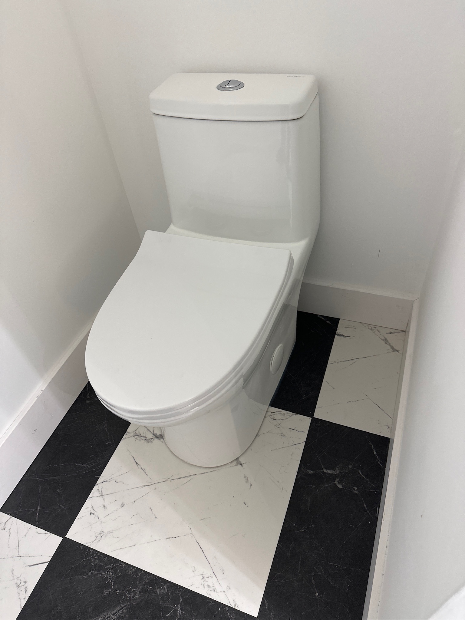 Modern toilet in a tiled bathroom