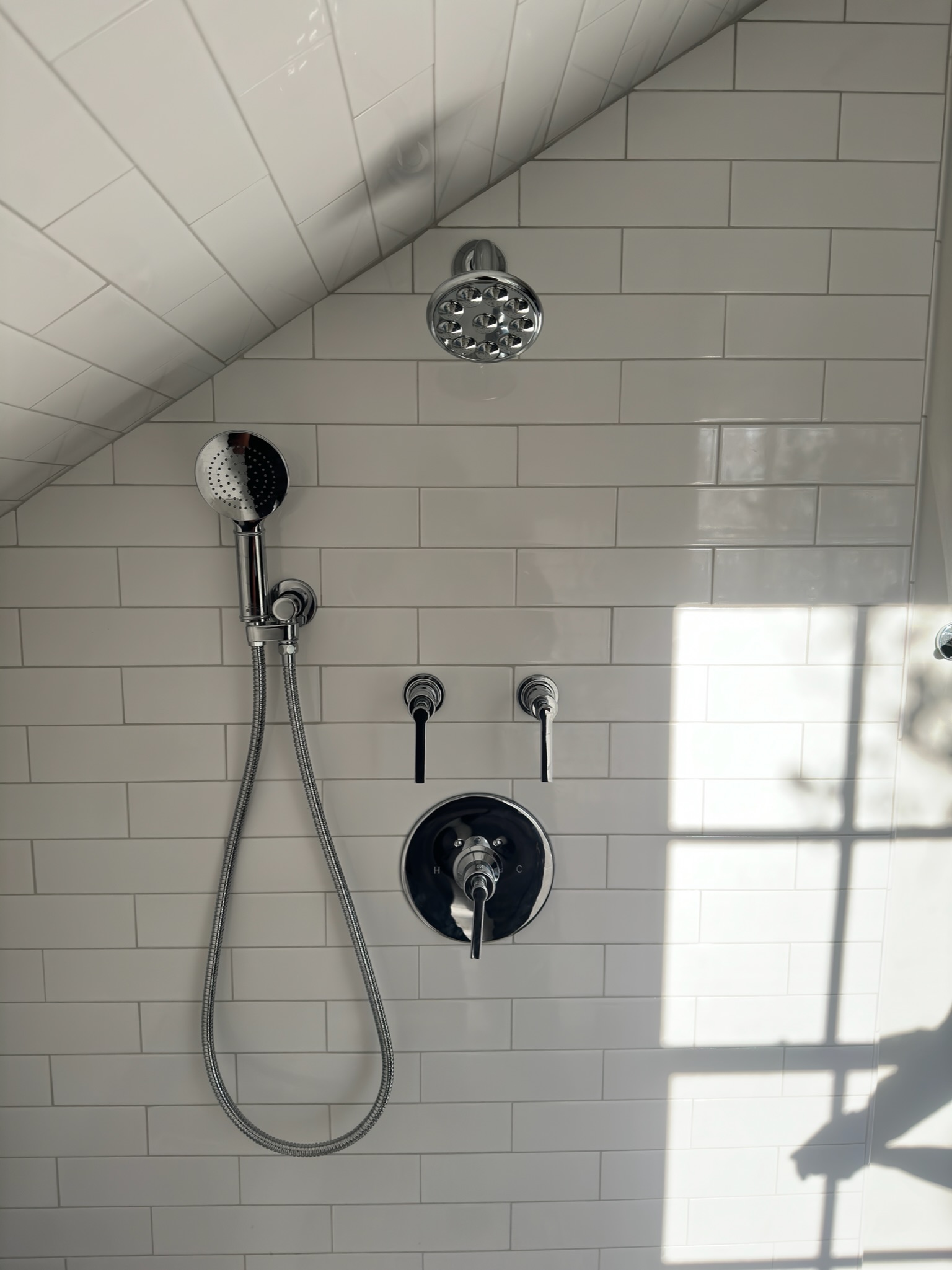 Tiled shower and plumbing fixtures